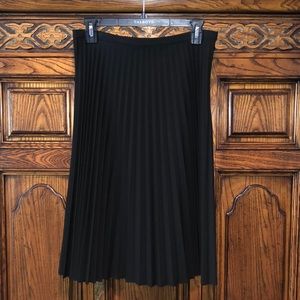 Another swingy skirt with pleats that stretched when you eat.